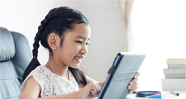 Girl learning on iPad at home